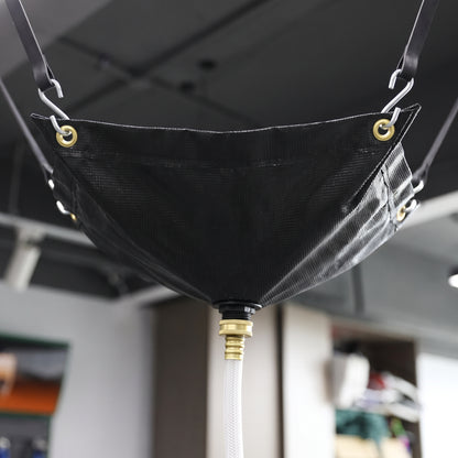 Black ceiling leak diverter hose outlet connection close-up (305 x 305cm)