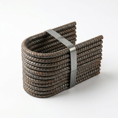 A bundle of coiled dark brown rebar bars wrapped with a gray metal strap, photographed on a clean white background.