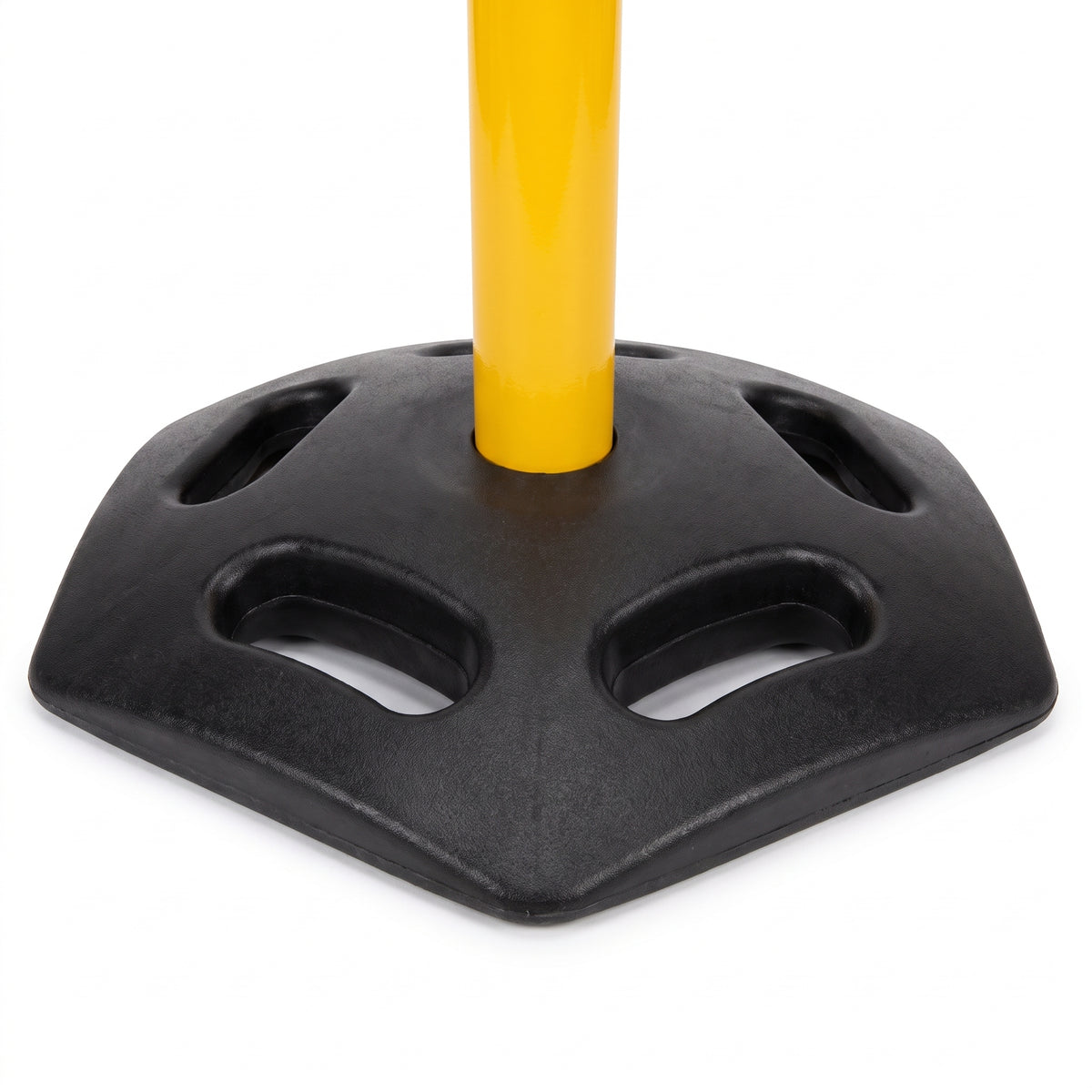A close-up of a black plastic base with cutout slots and a yellow pole inserted vertically in the center, shown on a white background.