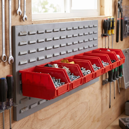 Row of small red hook-on bins on a louvre panel in a workshop