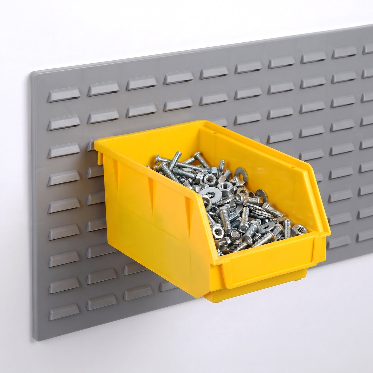 Medium yellow hook-on bin on a louvre panel filled with fixings